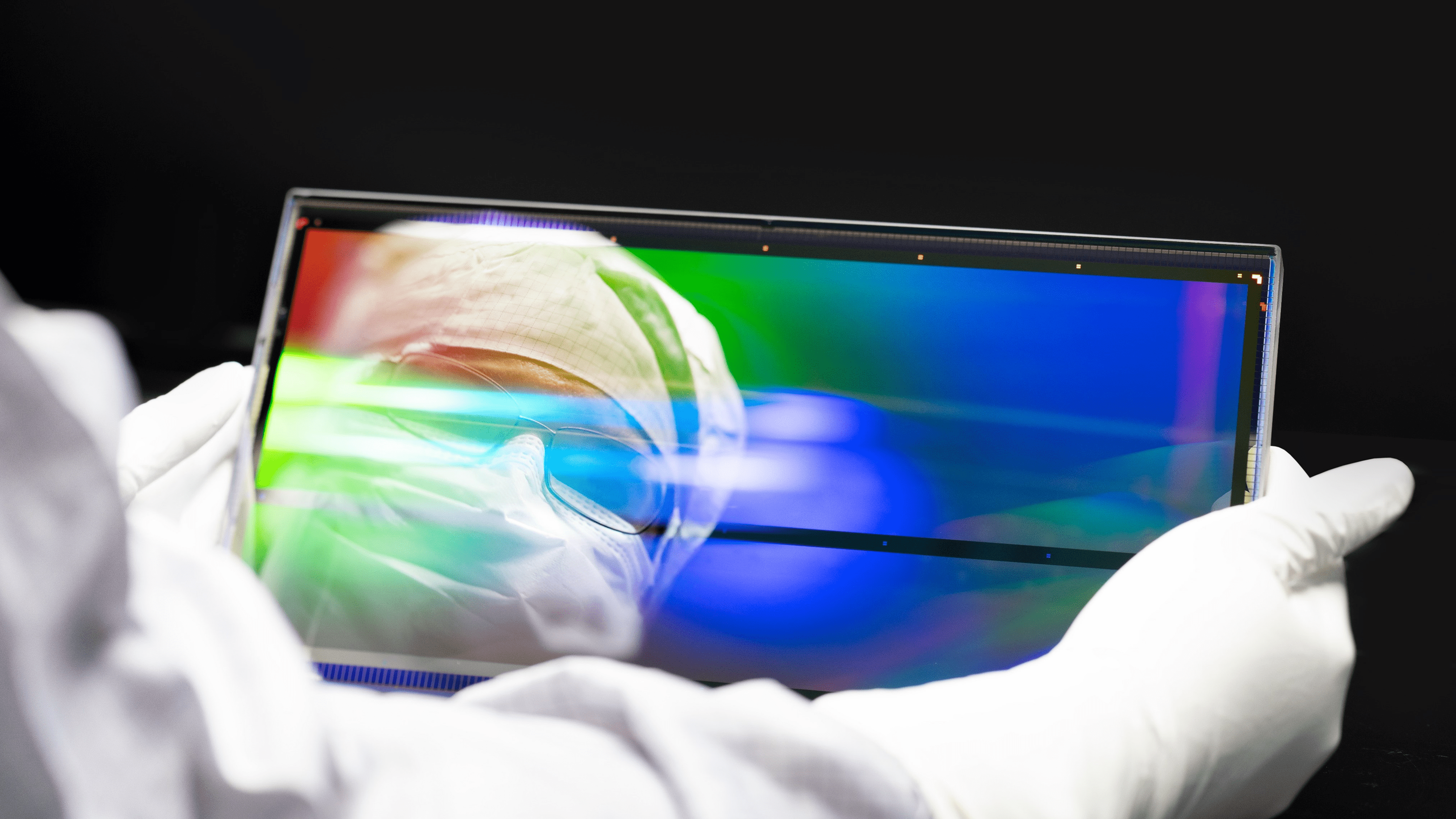 Scientist holding Glas frame